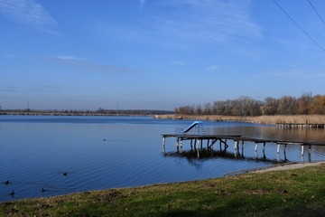 Landscape, sunny winter day on lake
