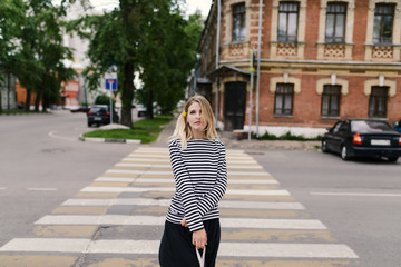 Outdoors portrait of beautiful young woman. Selective focus.