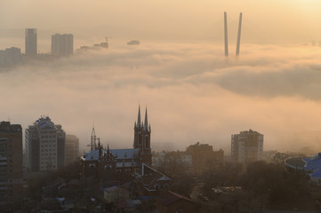 Obraz premium Vladivostok cityscape daylight view. Fog over the city.