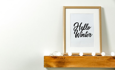 Winter background of frame with free space for your decoration.Wooden shelf on wall and copy space 