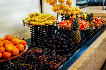 plates with fresh fruit oranges apples pineapple bananas healthy food