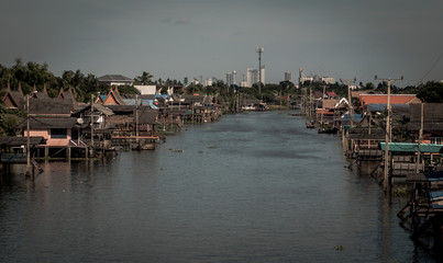 boat for travel in canal,Bangkok Thailand. Community canal in Bangkok Thailand  . Thai traditional houses along canal .Thai lifestyle .travel destination