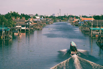 boat for travel in canal,Bangkok Thailand. Community canal in Bangkok Thailand  . Thai traditional...