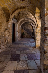 Arch at the entrance to Christian, Orthodox church close-up (ancient city of Mystras, Greece, Peloponessus)