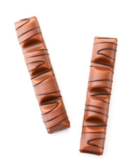 Two waffle sticks covered with chocolate on a white background. The view of top.