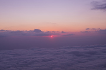 Scenic view of clouds and mist at sunrise