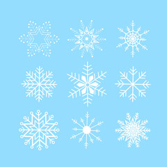 Fototapeta na wymiar Set of abstract ice crystal snow flakes on blue background. Winter pattern