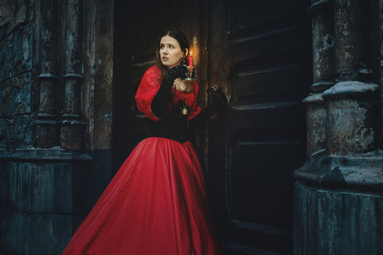 Woman in a red Victorian dress