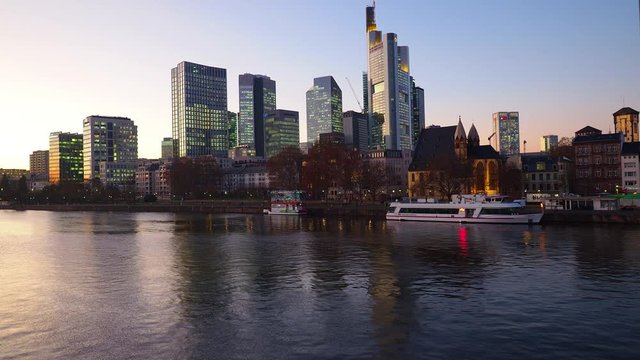 View from Eiserner Steg / The Iron Bridge on Main River to the business centre of the city Frankfurt, July 2019