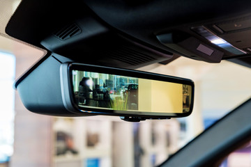 Rear view mirror in modern car with camera and display