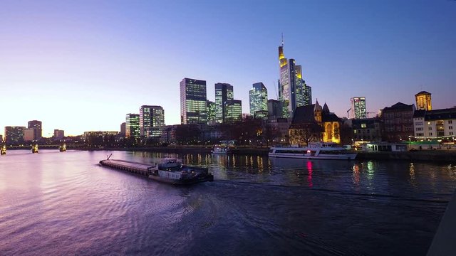 View from Eiserner Steg / The Iron Bridge on Main River to the business centre of the city Frankfurt, July 2019