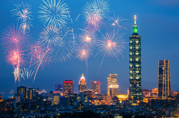 Naklejka premium New Year colorful fireworks with cityscape taipei skyline in night time,Taiwan