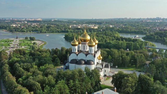 Aerial around view of the Assumption Cathedral in Yaroslavl, park Strelka and Volga river, Russia, 4k