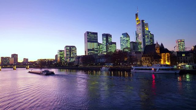 View from Eiserner Steg / The Iron Bridge on Main River to the business centre of the city Frankfurt, July 2019