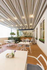 Hotel restaurant terrace interior with heater
