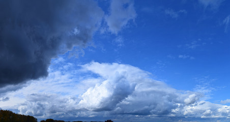 Cloudy sky. Autumn atmospheric phenomenon, panoramic photography, mid-September.