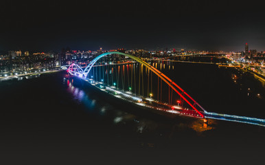 Crescent Bridge - landmark of New Taipei, Taiwan with beautiful illumination at night, photography in New Taipei, Taiwan.