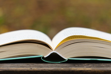 open book on wooden table