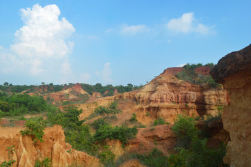 Fototapeta na wymiar Gangani, the beautiful red Grand Canyon of West Bengal,with blue
