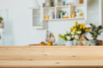 Wooden table in front of a blurred background. Perspective brown wood with blurry grunge or old wall backdrop - can be used to showcase or mount your products. Mock up to display the product.