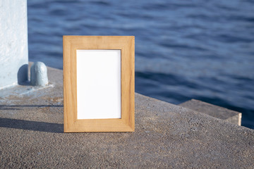 Wooden photo frame in front seaside