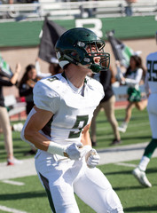 Fototapeta premium Football player in action during a game in South Texas