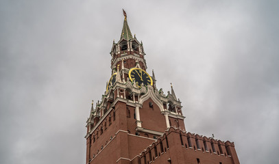 The tower of the Moscow Kremlin against the gray sky.
