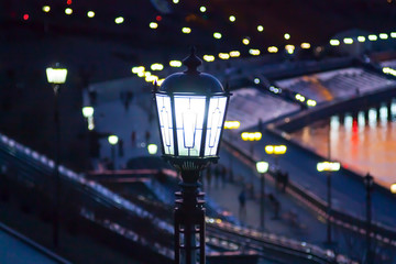 Burning street lantern on the quay in Tyumen, Russia