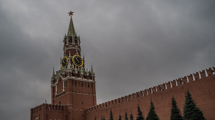 The tower of the Moscow Kremlin against the gray sky.