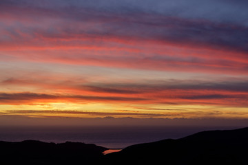 Vibrant Sunset over West Marin looking at Rodeo Lagoon and the Pacific Ocean. Sausalito, Marin County, California, USA.