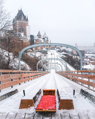 Naklejka premium Toboggan slide in Old town of Quebec Canada. Can see the Chateau frontenac in background 