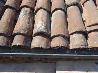 Roof in the foreground with brick tiles