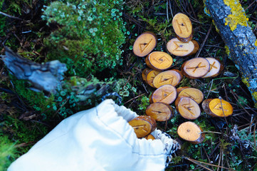 the runes are scattered on the green grass