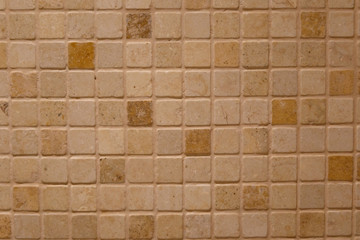 Obraz premium Abstract mosaic background. Wall tiles beige color. The texture mosaic