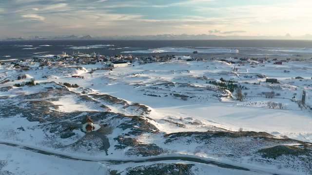 Winter in Hus&oslash;ya village, Tr&aelig;na islands, Nordland, Northern Norway, aerial drone shot