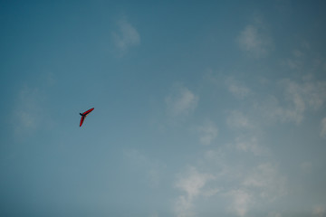 Hang glider high in the blue sky
