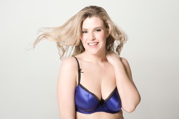 Portrait Of Happy Sexy Woman In Blue Bra