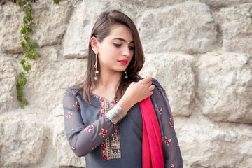 Portrait of indian girl in traditional dress. Traditional accessories of Indian girls. 