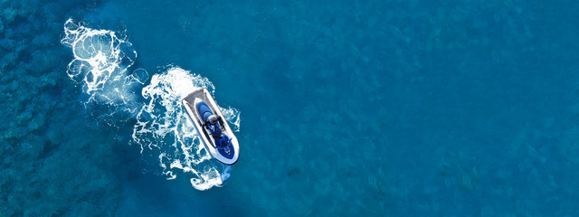 Aerial drone ultra wide top view photo of jet ski water craft cruising in deep blue Mediterranean...
