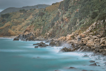 Obraz premium The rocks of the bay of Rovaglioso, in the purple coast.
