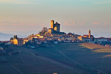 Winter view at golden hour of Serralunga D'Alba village and its castle, in the famus Langhe region,...