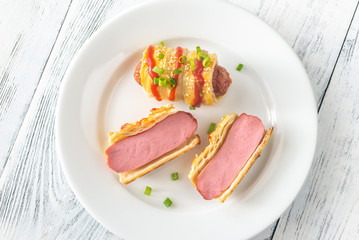 Sausage rolls on the white plate