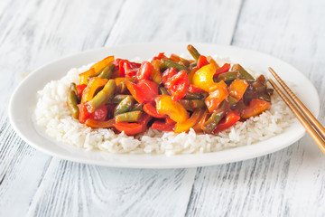 Portion of white rice and fried vegetables