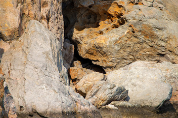 The big stones in the water of the ocean