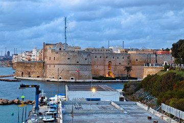 View of the Aragonese castle of Taranto, the old city and the industrial port, from the waterfront...