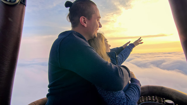 Adventure Love Couple On Hot Air Balloon Watermelon. Man And Woman Kiss Hug Love Each Other. Burner Directing Flame Into Envelope. Fly In Morning Blue Sky. Happy People Take Selfie In Hot Air Ballon.