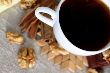 A cup of coffee. White dishes. Coffee and chocolate. Morning ritual.