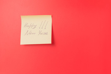 Paper sticker with inscription on red background