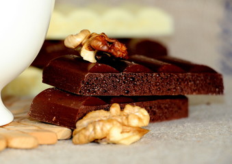A cup of coffee. White dishes. Coffee and chocolate. Morning ritual.