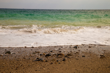 the wave rolling on the sand